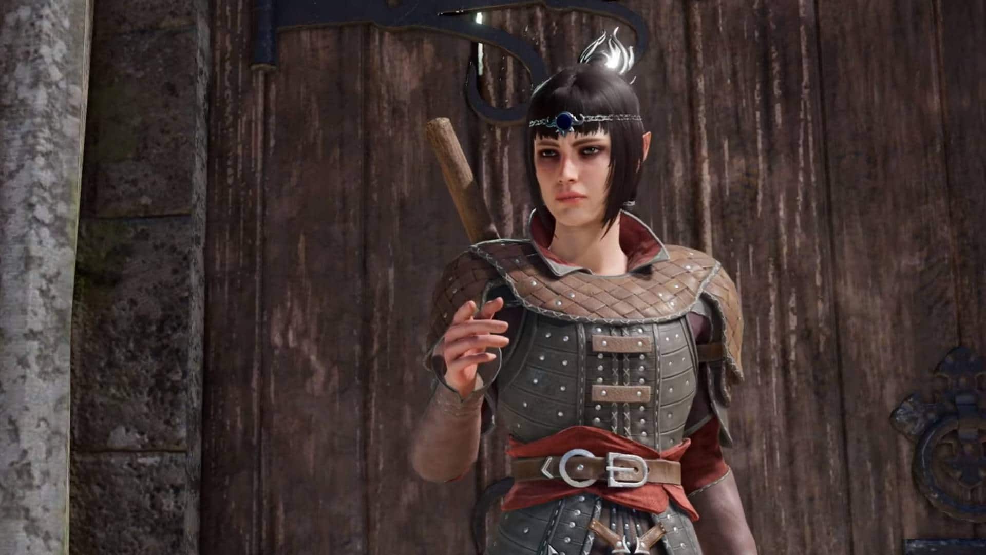 Shadowheart aus Baldur's Gate 3 vor einem Tor im Dialog mit dem Protagonisten